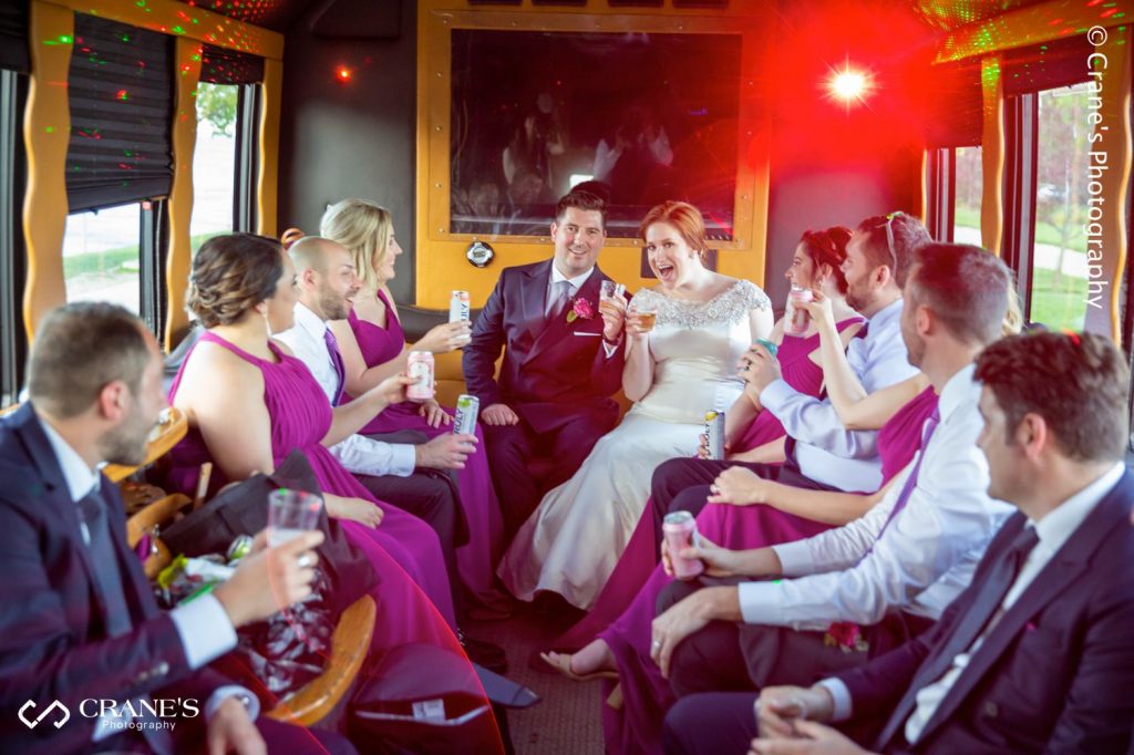 Wedding party in a limo bus
