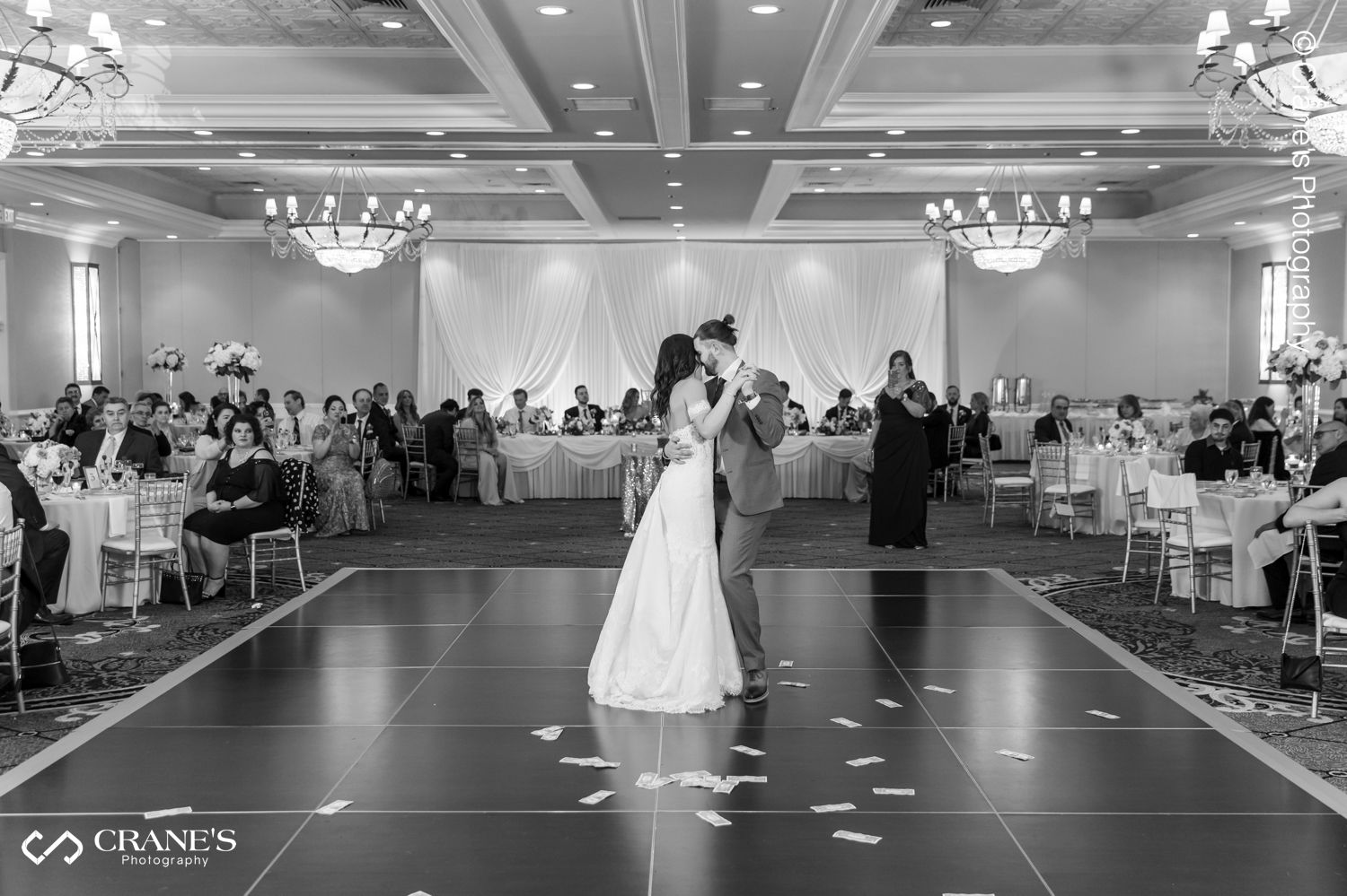 Bride and groom's first dance in the middle of the dance floor