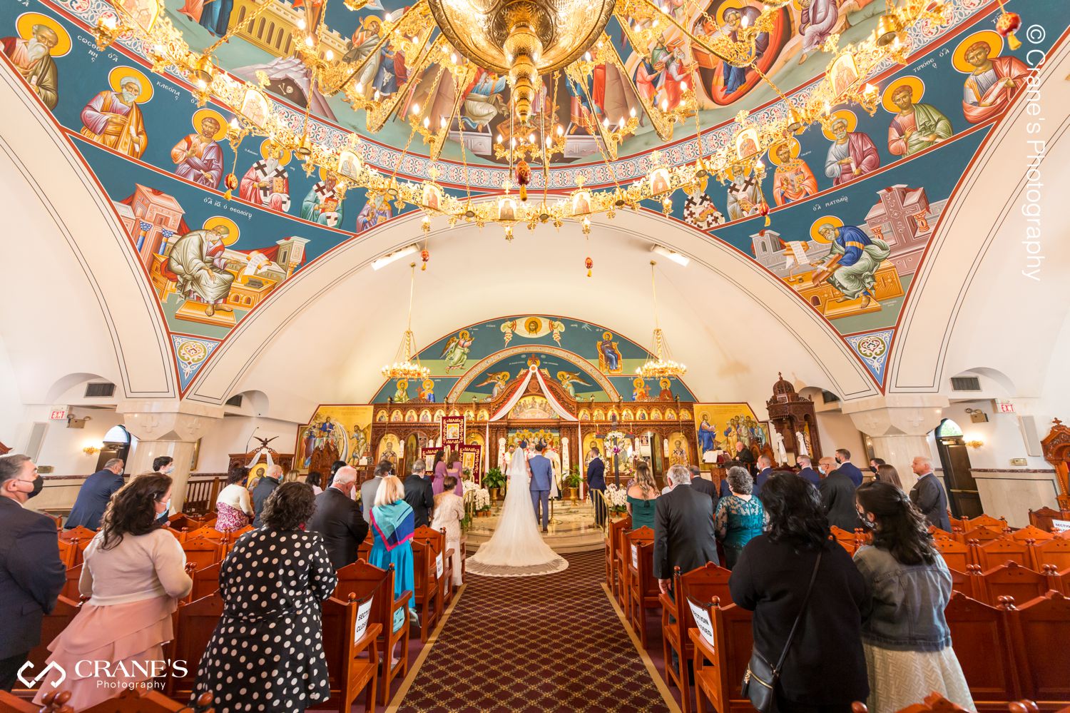 A wide angle view of the altar during a traditional orthodox wedding ceremony at Holy Taxiarhai St. Haralambos Greek Church