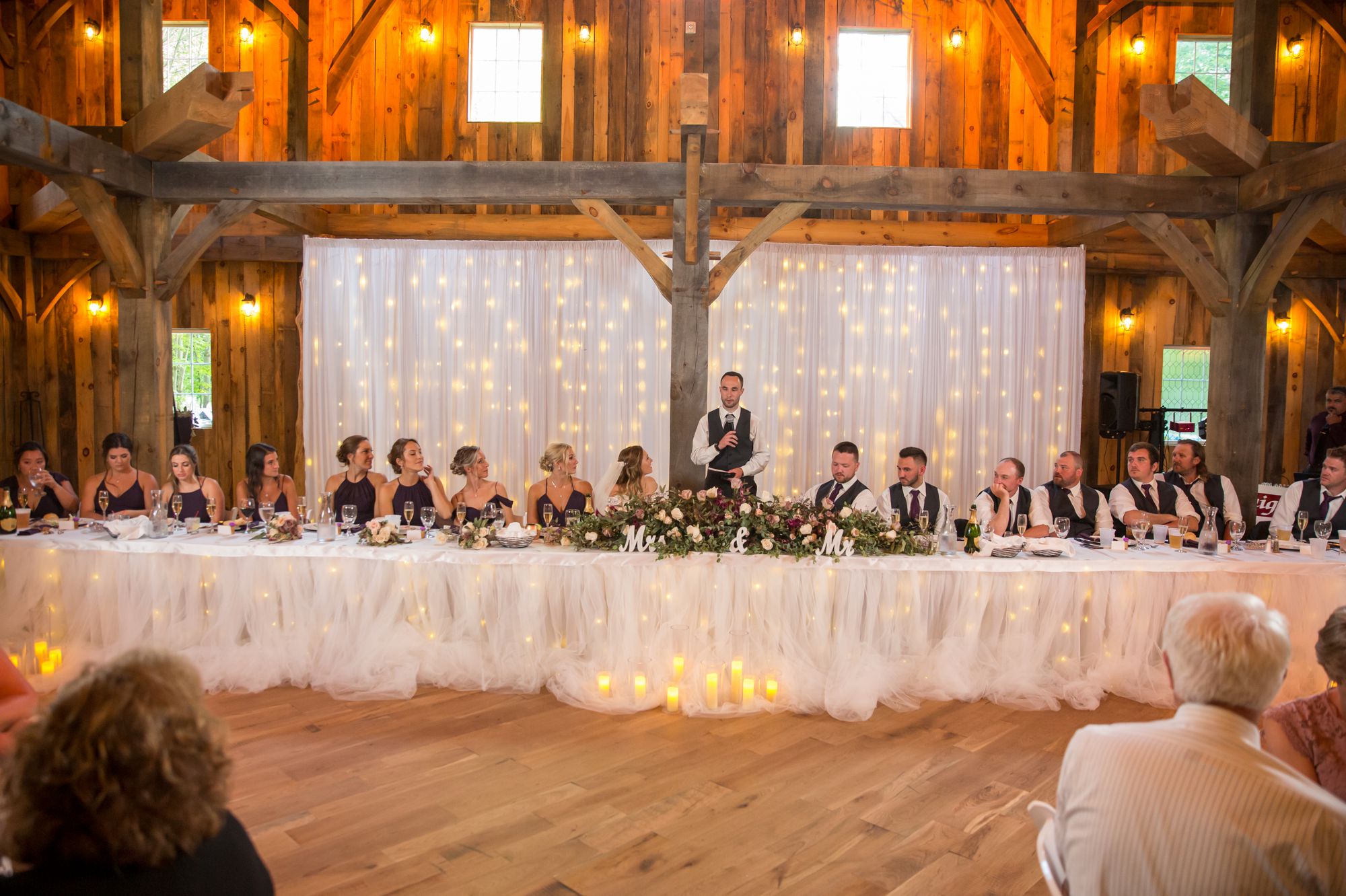 A candid moment during wedding reception at The Swan Barn Door