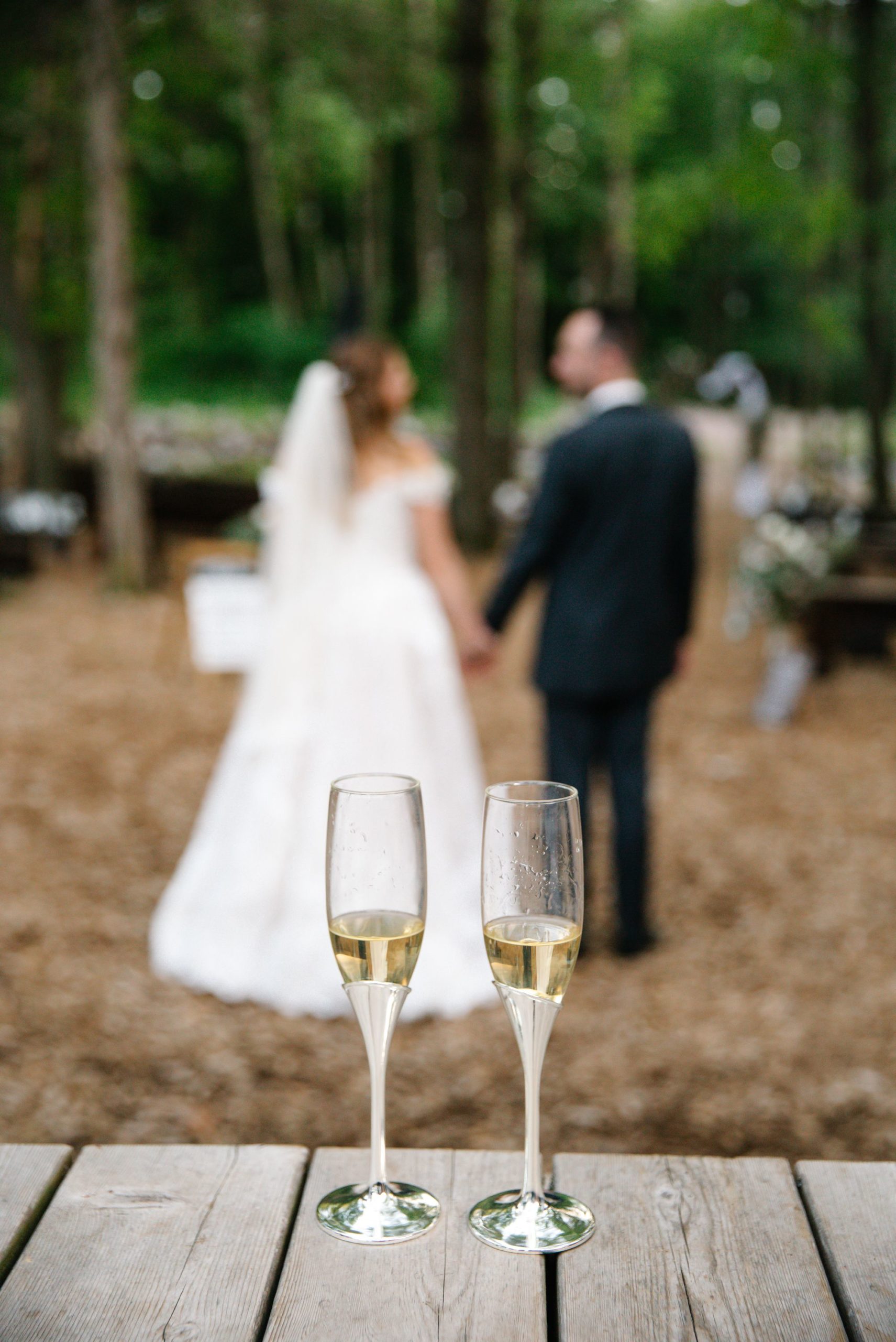 Creatively composed image of wedding champagne glasses at The Swan Barn Dooor