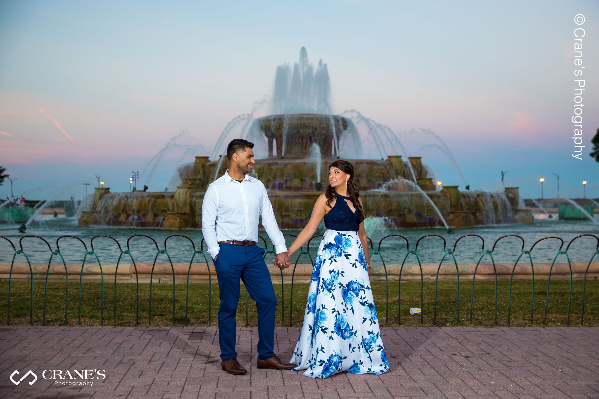 A sunset engagement photo at the Buckingham Fountain