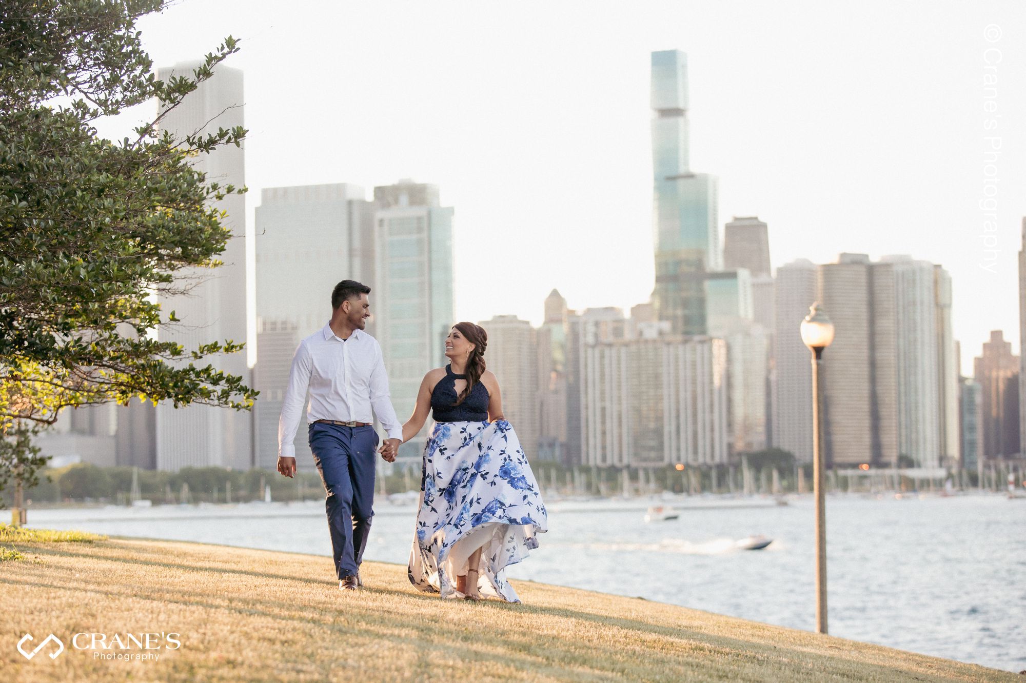 An engagement session photo showing downtown Chicago in the background