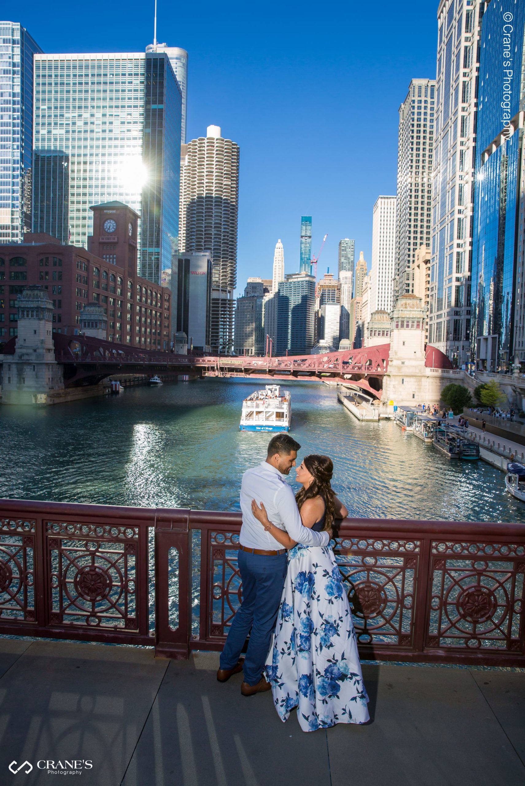 Engagement session photos of couple wearing formal wear taken on the Riverwalk in downtown Chicago