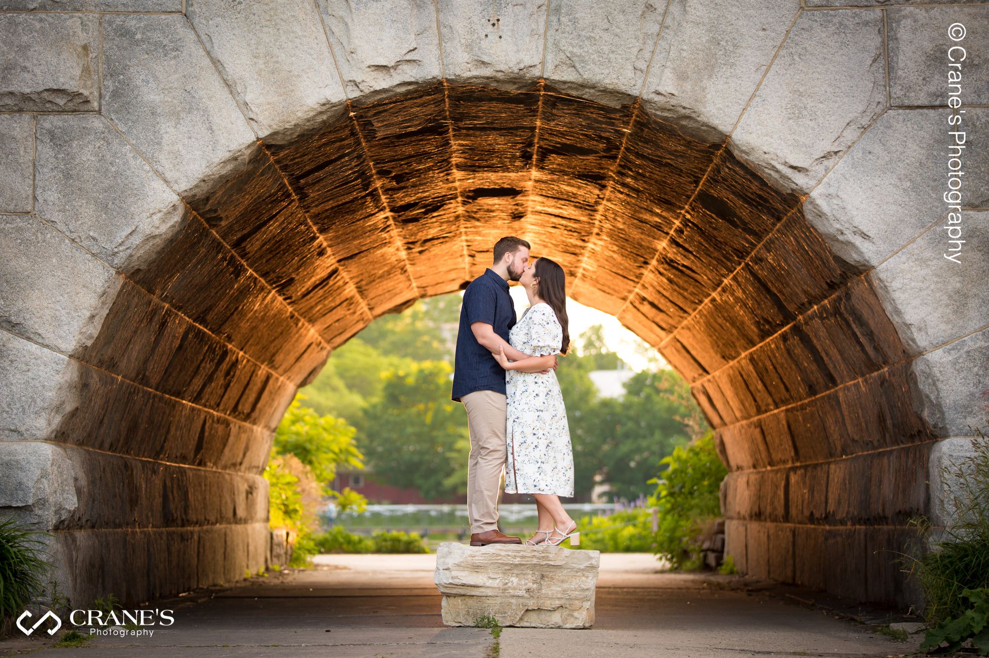 An engaged couple kissing at tunnel at Ulysses S. Grant Monument during their Lincoln Park engagement session