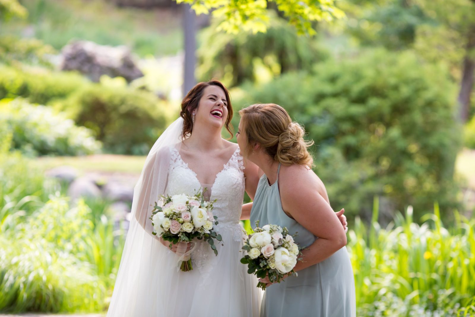 A candid photo of Jenny with her bridesmaid at Fabyan Japanese Garden