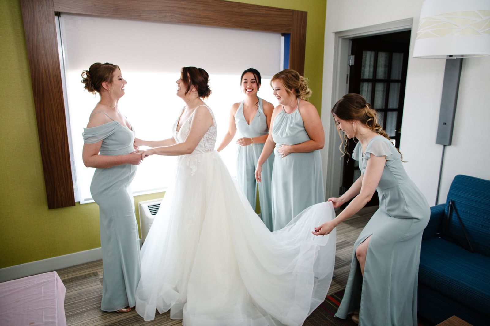Jenny's bridesmaids are helping her get ready for her wedding at Two Brother's Roundhouse