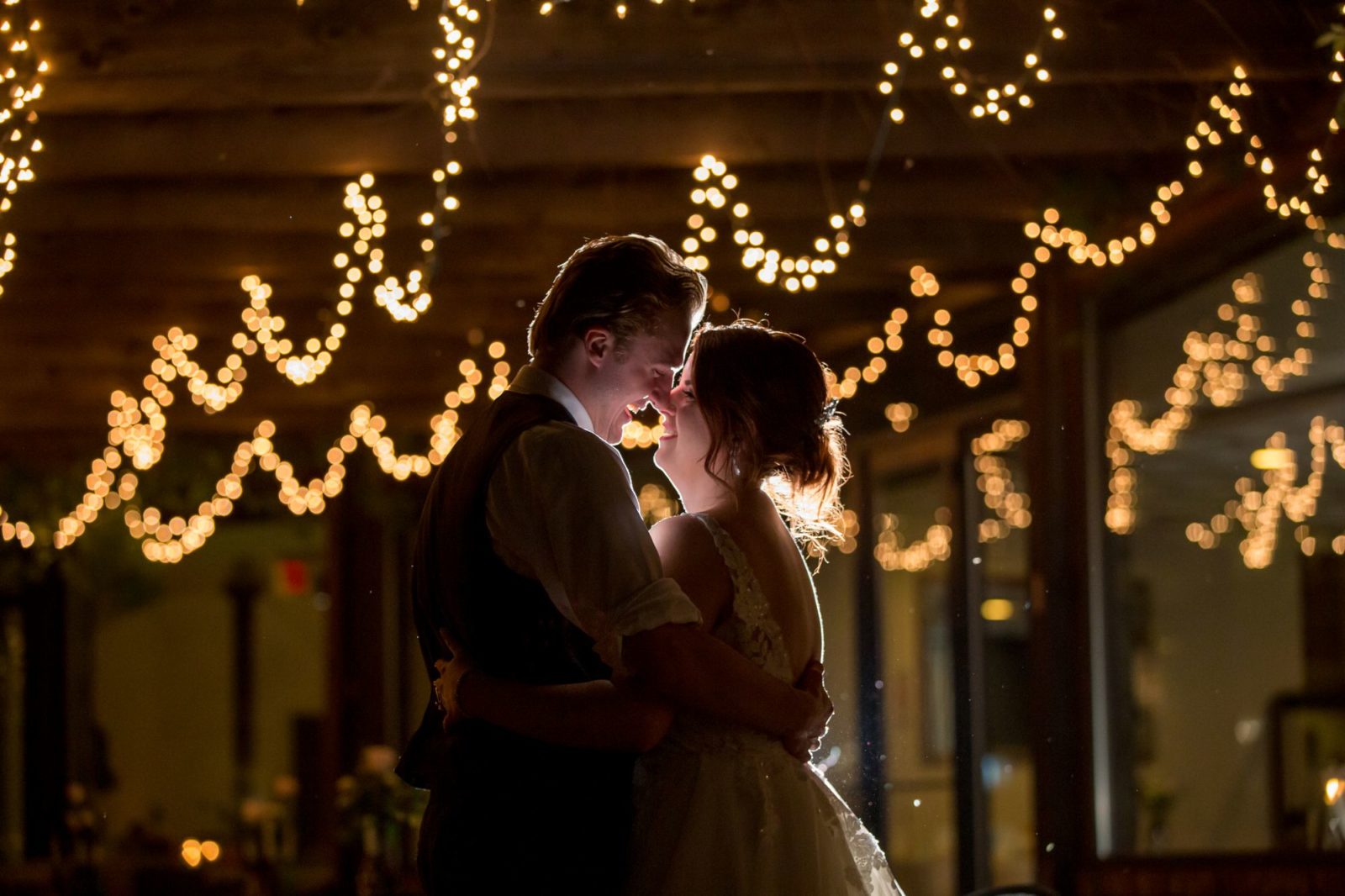 A night photos with creative lighting of a bride and groom at Two Brother's Roundhouse