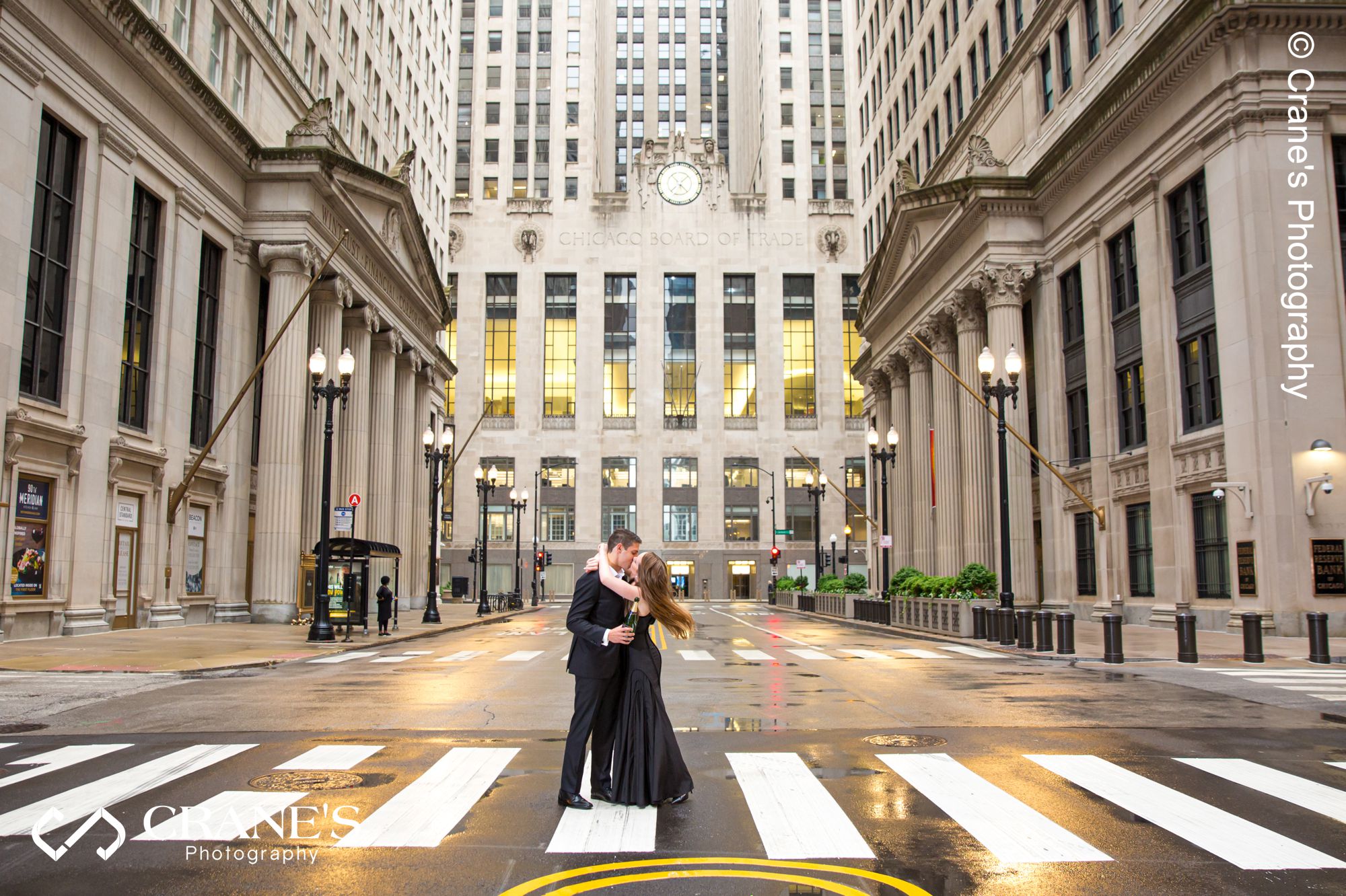 The Board of Trade Building engagement photo on a rainy day