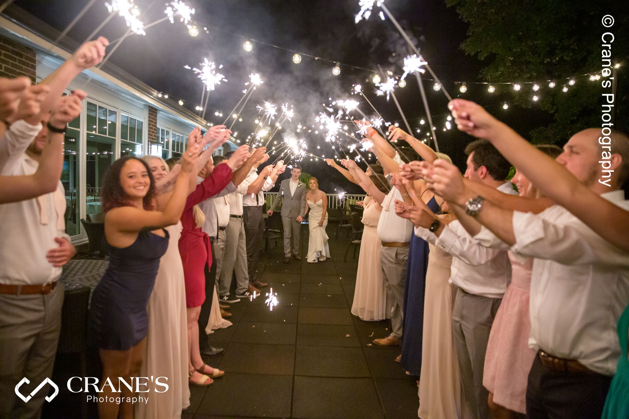 A wedding sparklers sent-off on the terrace of Big Foot Country Club