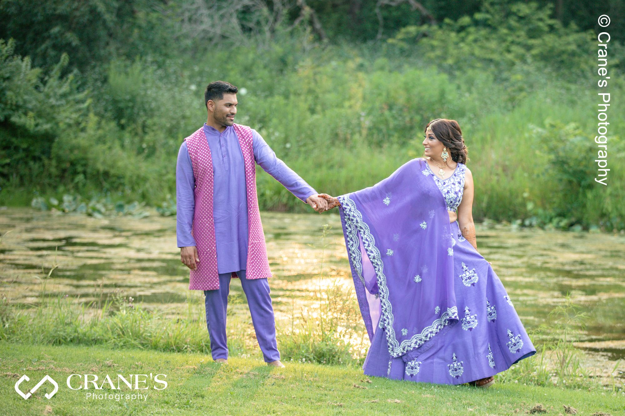 An outdoor portrait of an Indian bride and groom at their Chicago wedding at Creek Bend
