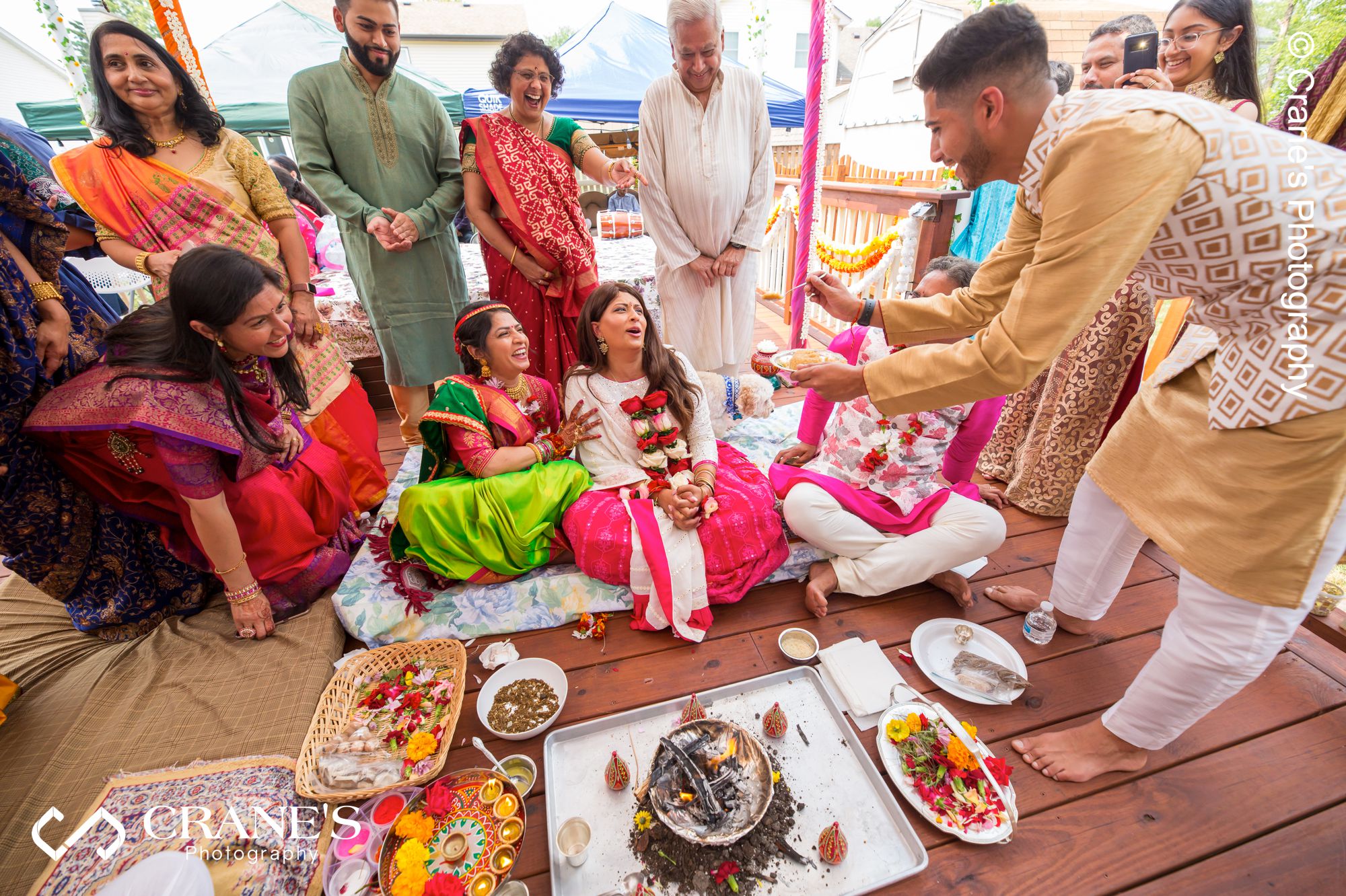 A candid moment during the pre-wedding GANESH PUJA Hindu ceremony