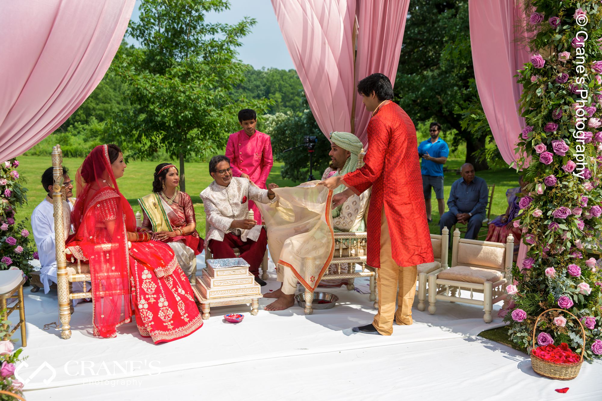 The reveal moment at a mandap during an outdoor Indian Wedding in Chicago