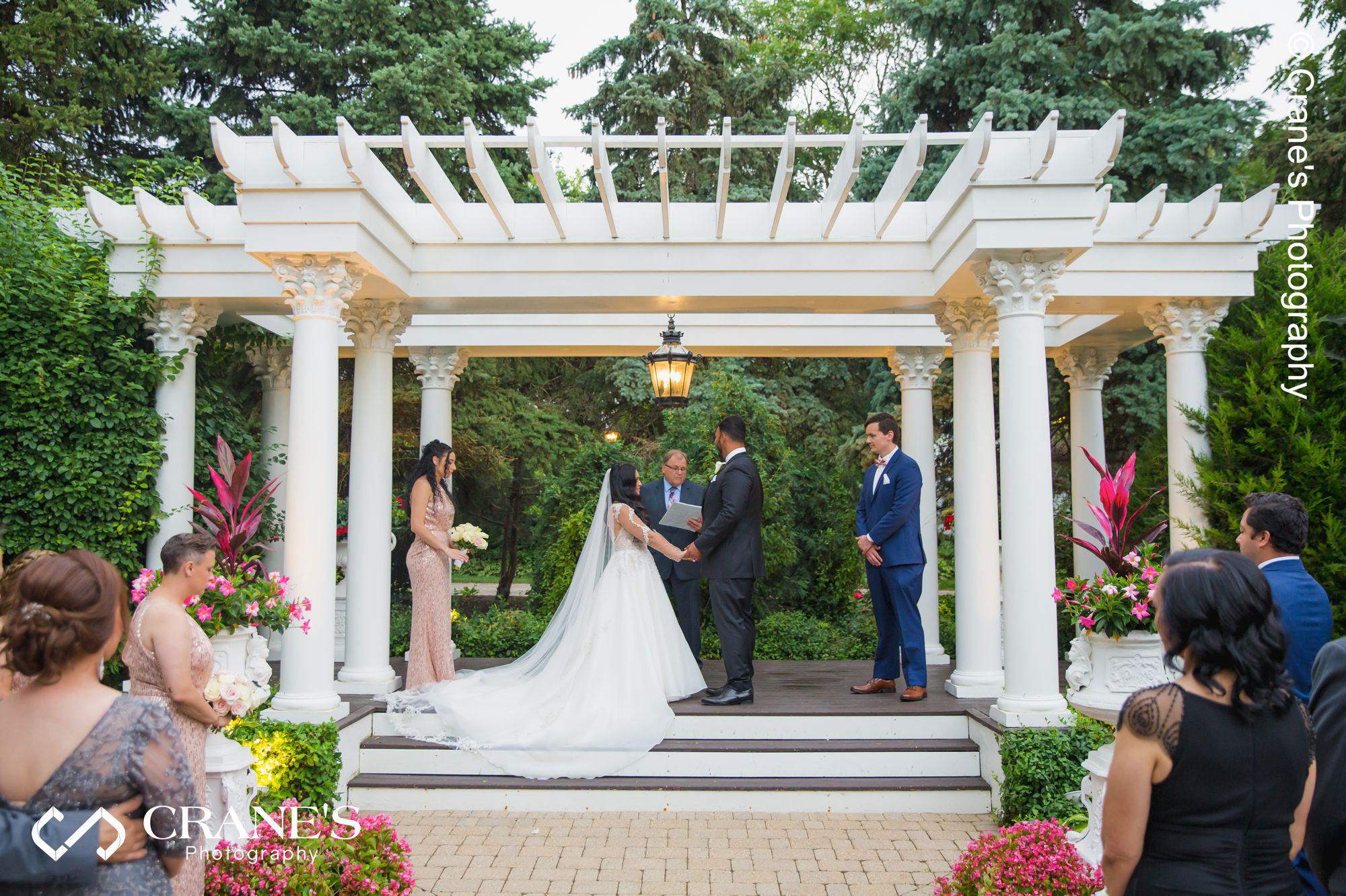 Outside wedding ceremony at the pergola at Haley Mansion