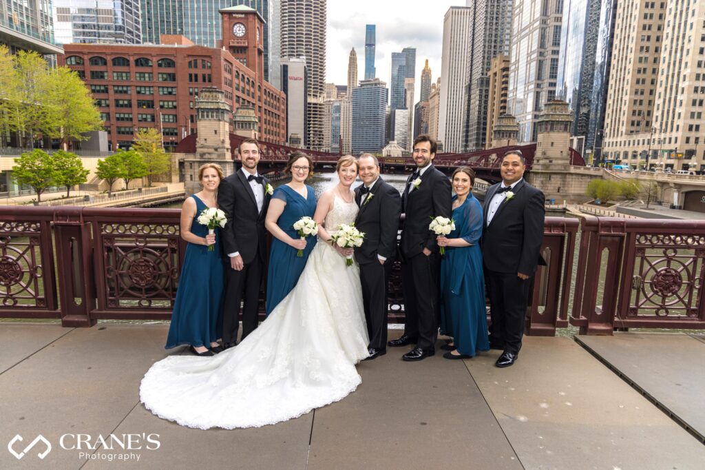 Wedding party portrait taken at Wells Street Bridge with Chicago River in the background.