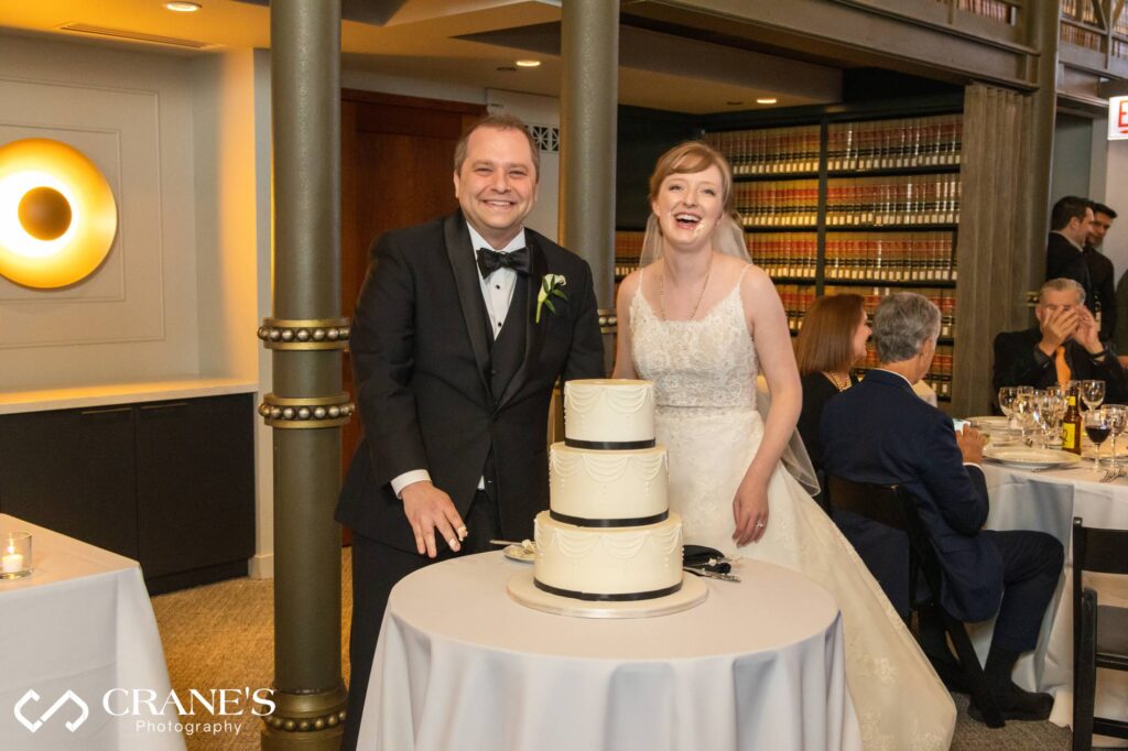 Bride and groom cut their wedding cake at The Library at 190 South LaSalle.