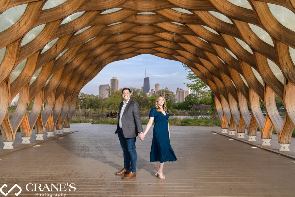 An elegant couple posing for an engagement session at Lincoln Park's Honeycomb.