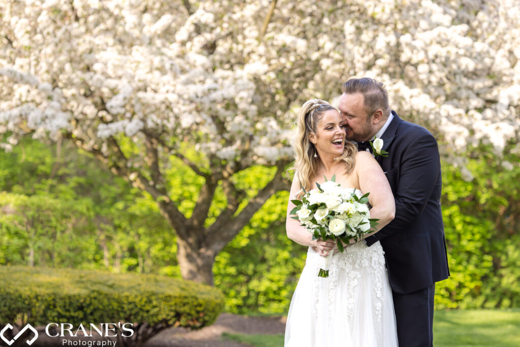 Royal Melbourne Country Club wedding photo taken on spring day with flowering trees in the background.