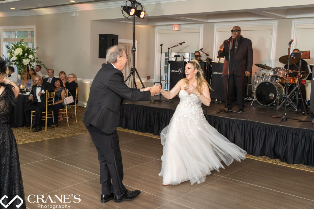A father-daughter wedding dance at Royal Melbourne Country Club.