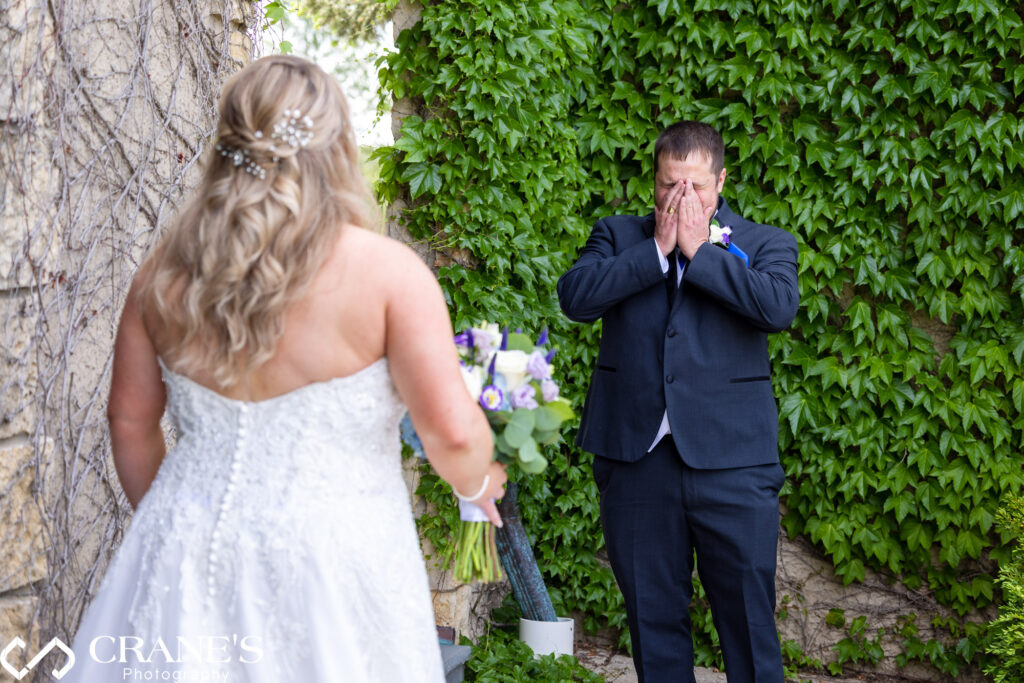 Grooms cries when he sees his wife at their Summer Wedding at Makray Memorial in Barrington, IL