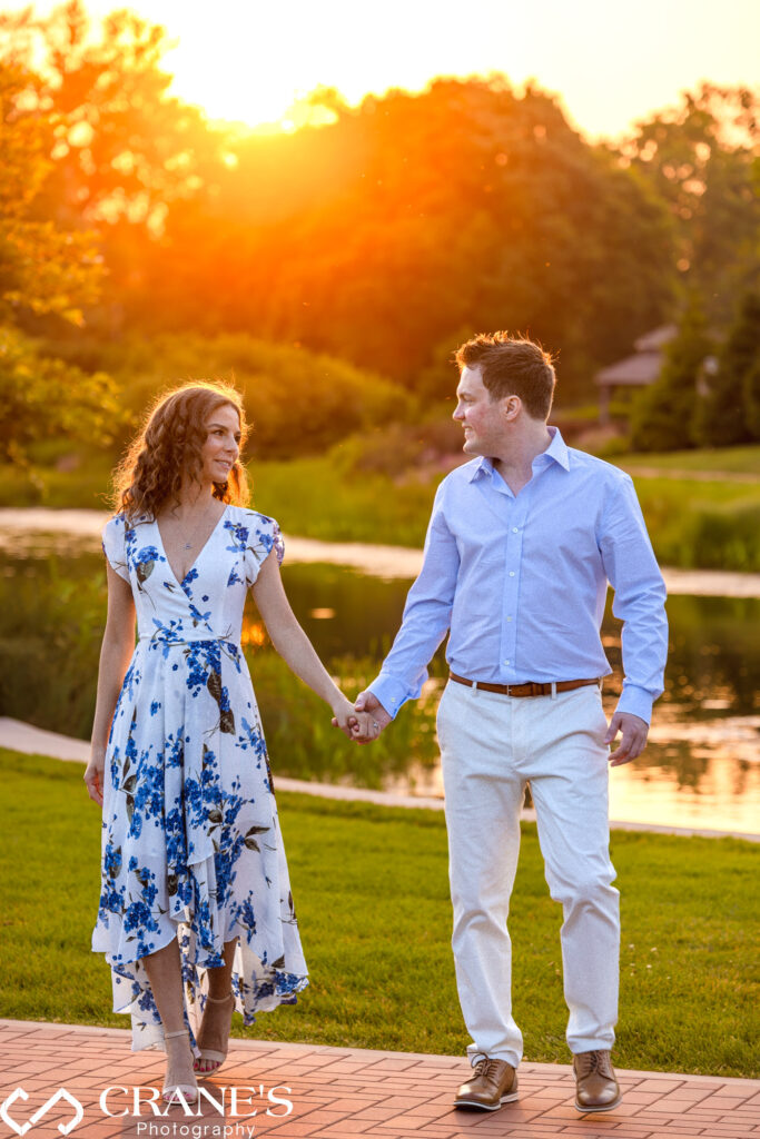A summertime engagement photo at Cantigny Park during the golden hour.