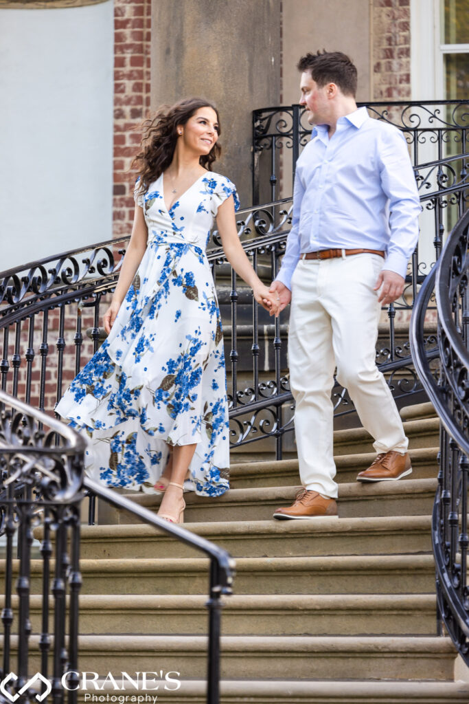 An engagement session photo at the stairs at Robert R. McCormick House at Cantigny Park on a summer day 