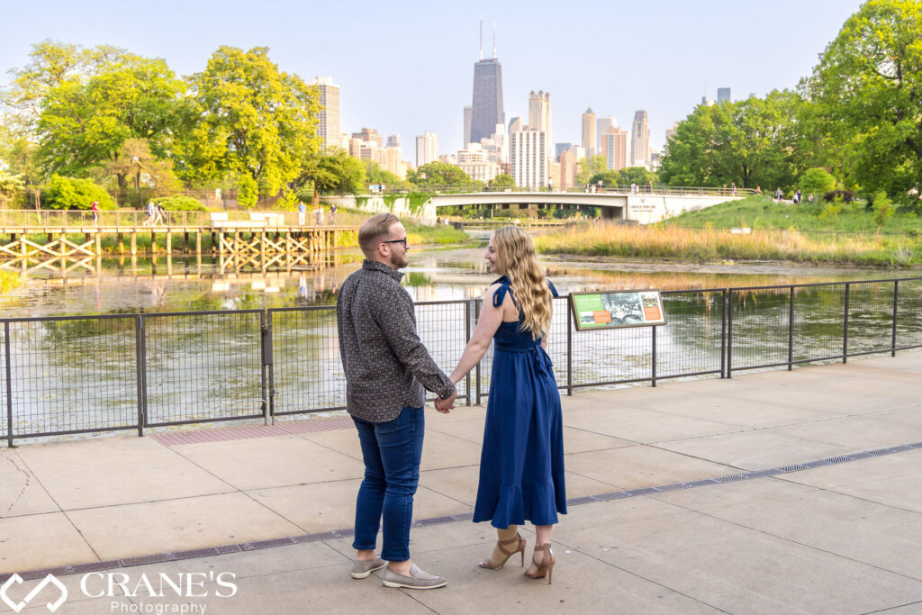 Lisabeth and Byron engagement photo near the South Pond in Lincoln Park
