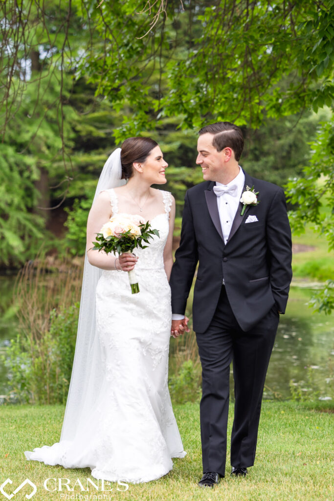 Bride and groom wedding portrait near the entrance of Royal Melbourne Country Club on a summer day.