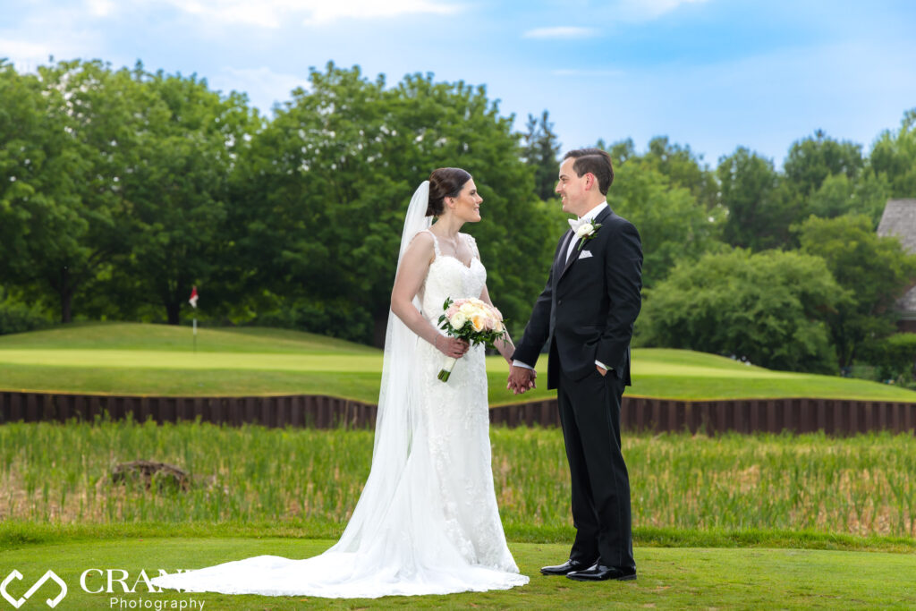 Classic summer wedding photo with blue skies and beautiful trees at Royal Melbourne country club.