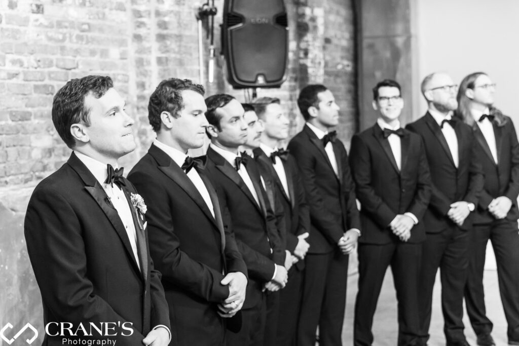 Groomsmen wearing black jackets and ties during a wedding ceremony at Fairlie.