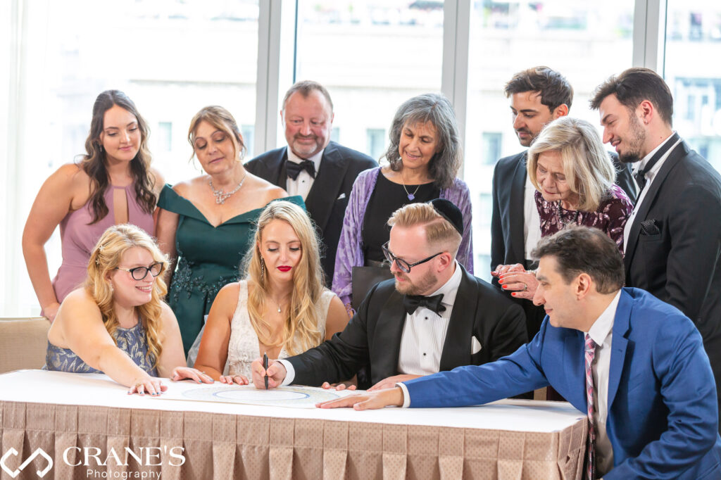Lisabeth and Byron participated in a private Jewish wedding ritual, signing the ketubah at Trump Tower.