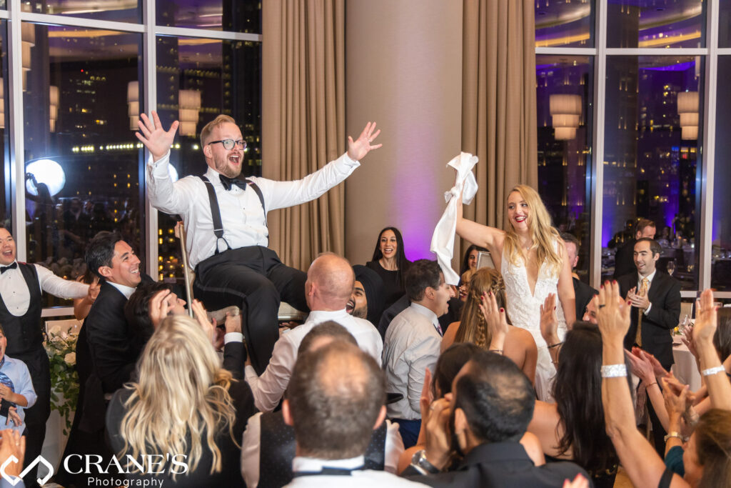 A traditional hora dance at Jewish wedding reception at Trump Tower Hotel in Chicago.