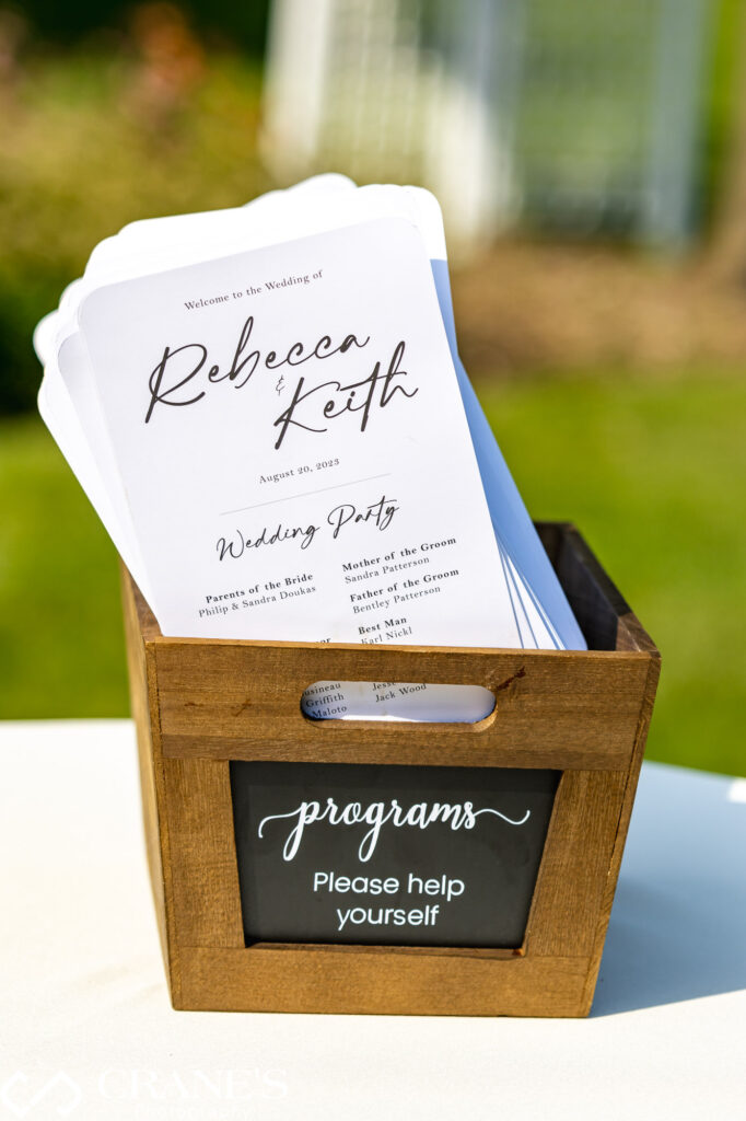 Wedding programs fans are a great thing to offer your guests on outdoor ceremony at Bloomingdale Golf Club.