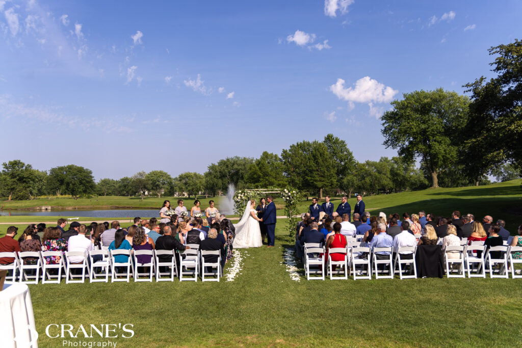 An outdoor wedding ceremony at Bloomingdale Golf Club.