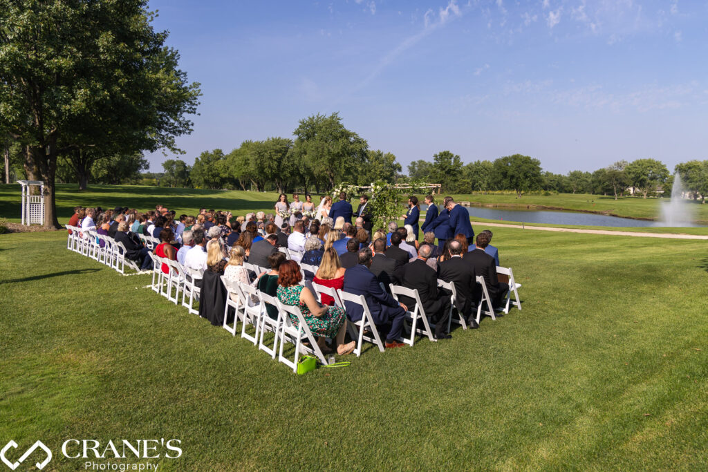 Wedding ceremony on a sunny day at Bloomingdale Golf Club.