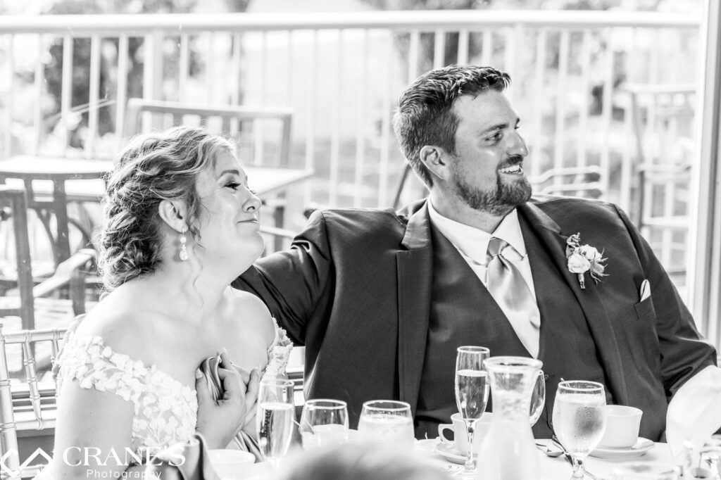 Emotional speech on a wedding day at Bloomingdale Golf Club makes the bride and groom tear up