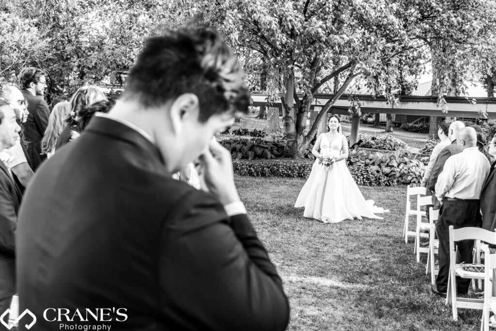 One of the most poignant moments of an outdoor wedding ceremony at Hyatt Lodge is when the bride laid her eyes on her groom as she was walking down the aisle.


