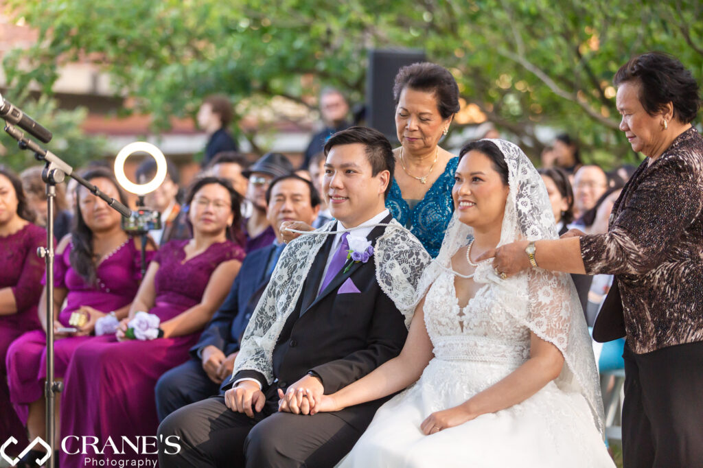 James and Beth chose to incorporate Filipino traditions into their wedding day at Hyatt Lodge, including a cord, veil, and an arras with its 13 coins