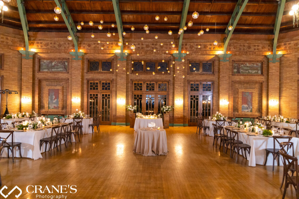 Elegantly decorated wedding reception at Cafe Brauer featuring suspended floating candles from the ceiling.