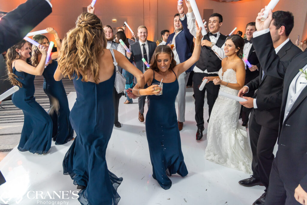 The wedding party dominates the dance floor at Loews Hotel in Rosemont.