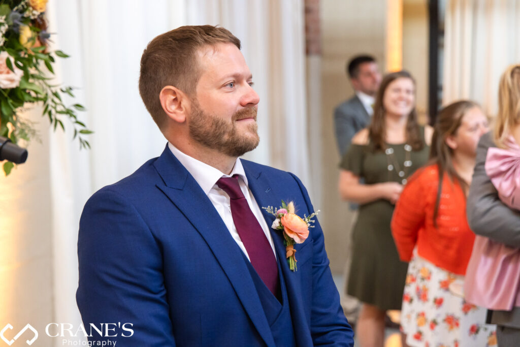 It's such a beautiful moment when the groom lays eyes on his stunning bride for the very first time on their special day in the North Atrium at Artifact Events.