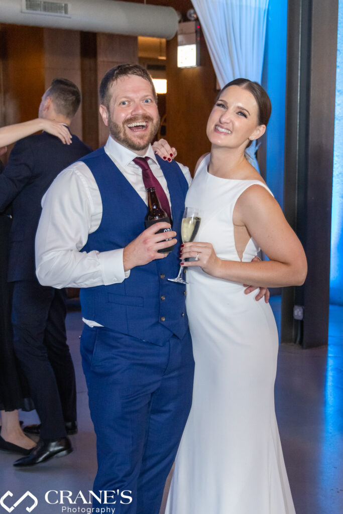 Newlyweds have fun on the North Atrium dance floor at Artifact Events.