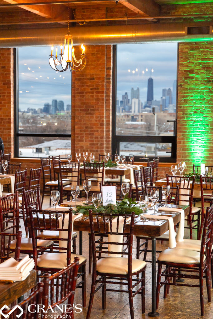 The wedding reception at City View Loft is adorned with the breathtaking backdrop of downtown Chicago, visible through the windows.