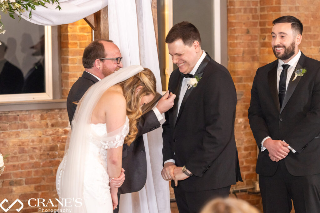 A delightful and humorous moment of joy unfolds during a wedding ceremony at City View Loft in Chicago, capturing the lighthearted spirit of the celebration.