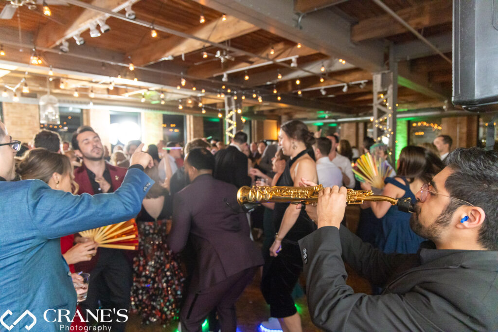 The dance floor at City View Loft comes alive with wild energy and lively moves as guests join in for an unforgettable celebration.