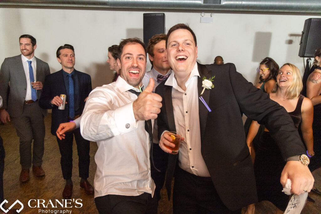 The groom takes center stage on the dance floor at City View Loft during his wedding reception.