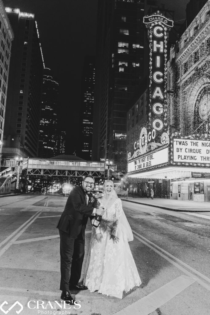 As the wedding festivities conclude at theWit, the bride and groom exuberantly spray champagne against the stunning night backdrop of the Chicago Theatre. This lively moment adds a touch of celebration and glamour to the end of their joyous union.