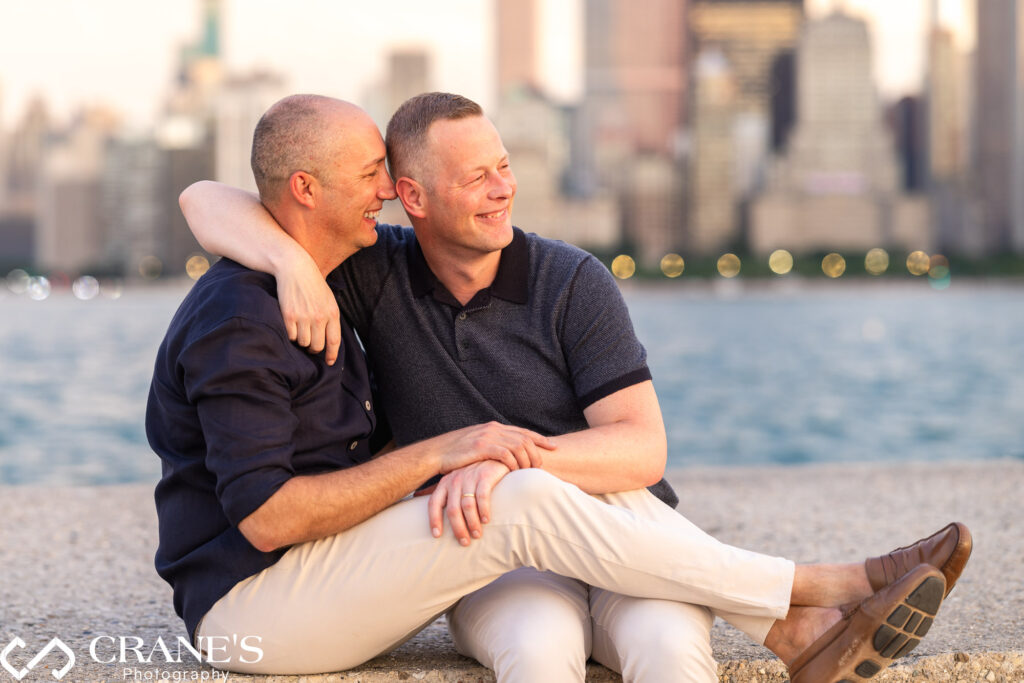 A joyful LGBTQ+ couple in Chicago, engaged in conversation and radiating happiness during their engagement session.