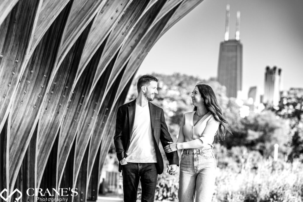 Black and white image of an engaged couple photographed at the Honeycomb in Lincoln Park.