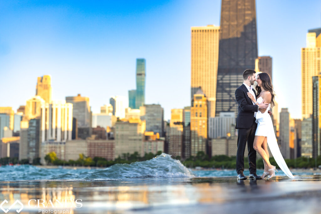 Stunning engagement photos captured at sunset on North Ave Beach, featuring an elegant couple with the Chicago skyline in the background.